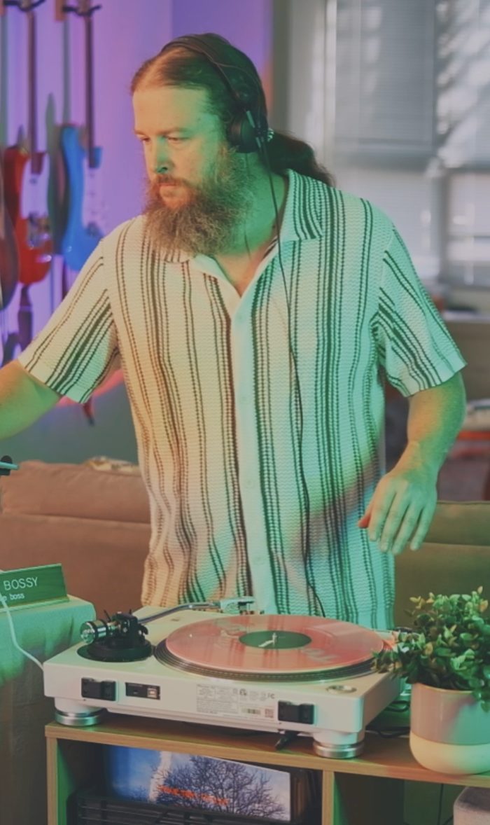 AJ Marshall DJing on a turntable